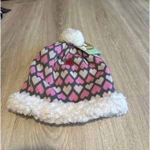 Woman’s size M/L Sherpa line Pom pom winter hat brand is Pudus New